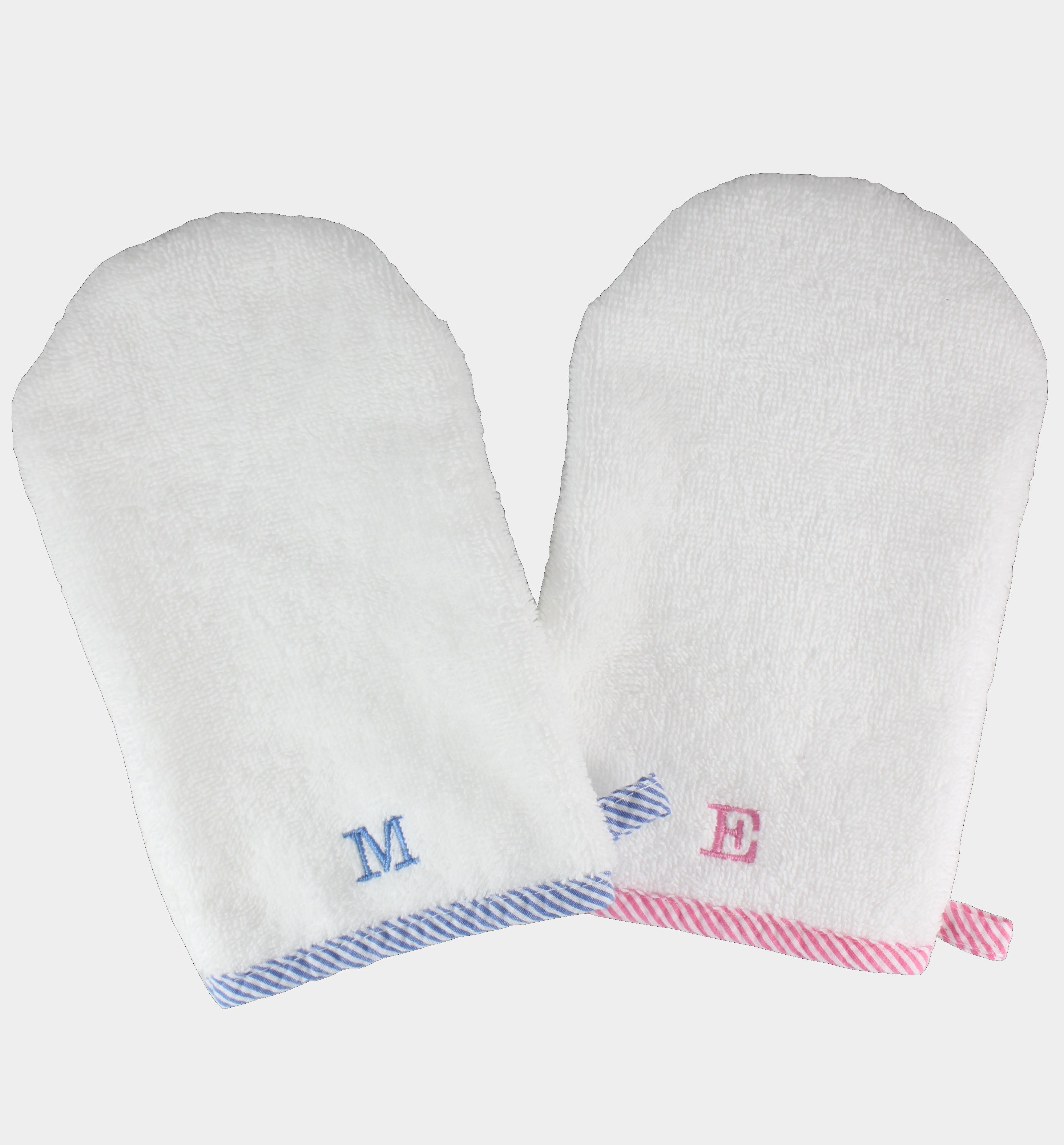 A pair of white bath mitts with blue and pink striped trim, featuring a monogrammed initial on the wrist area.